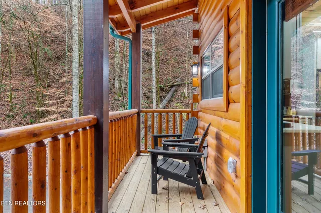 a view of balcony with wooden floor
