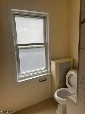 a bathroom with a toilet and a sink