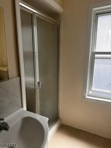 a bathroom with a bathtub and a sink