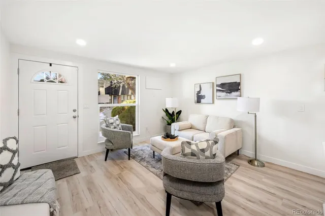 a living room with furniture and a table