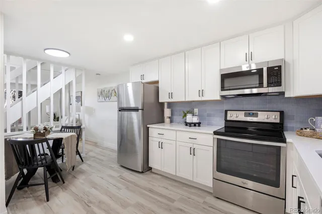 a bathroom with a sink and mirror with toilet