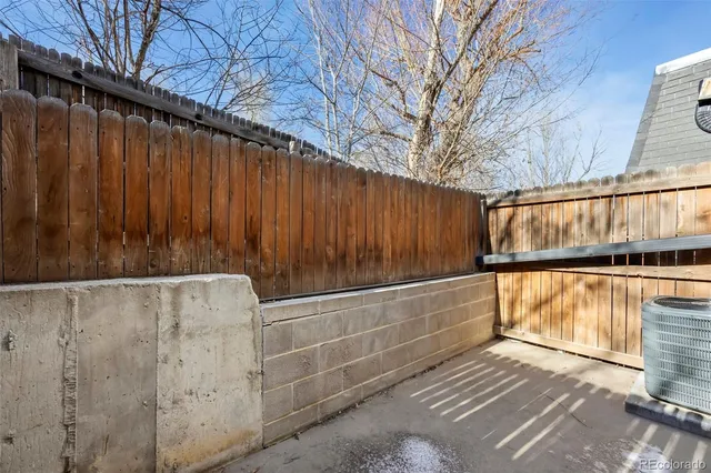 a kitchen with cabinets appliances a sink and a counter top space