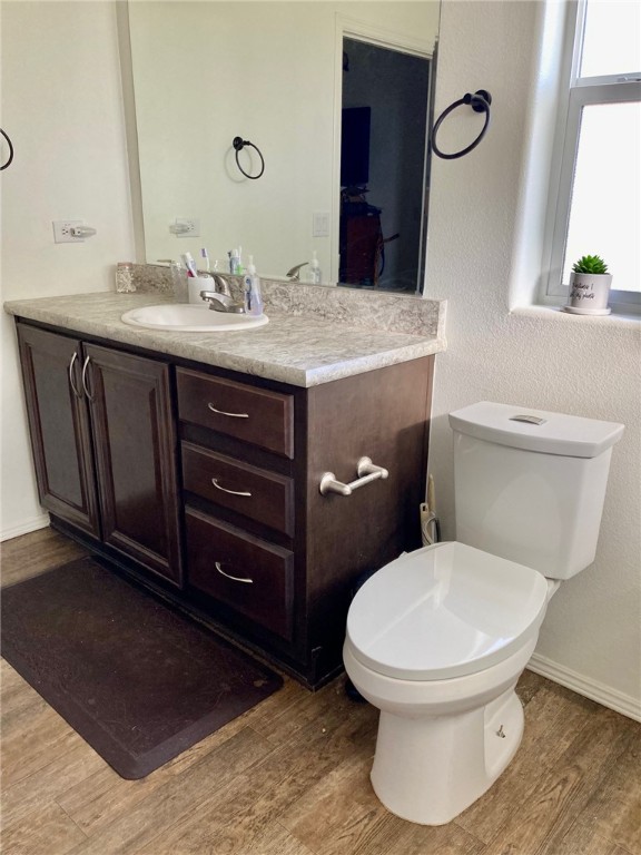 9918 East Blake Ranch Road Kingman, AZ 86401 - Photo 17 of 26 Bathroom with vanity and light wood-type flooring