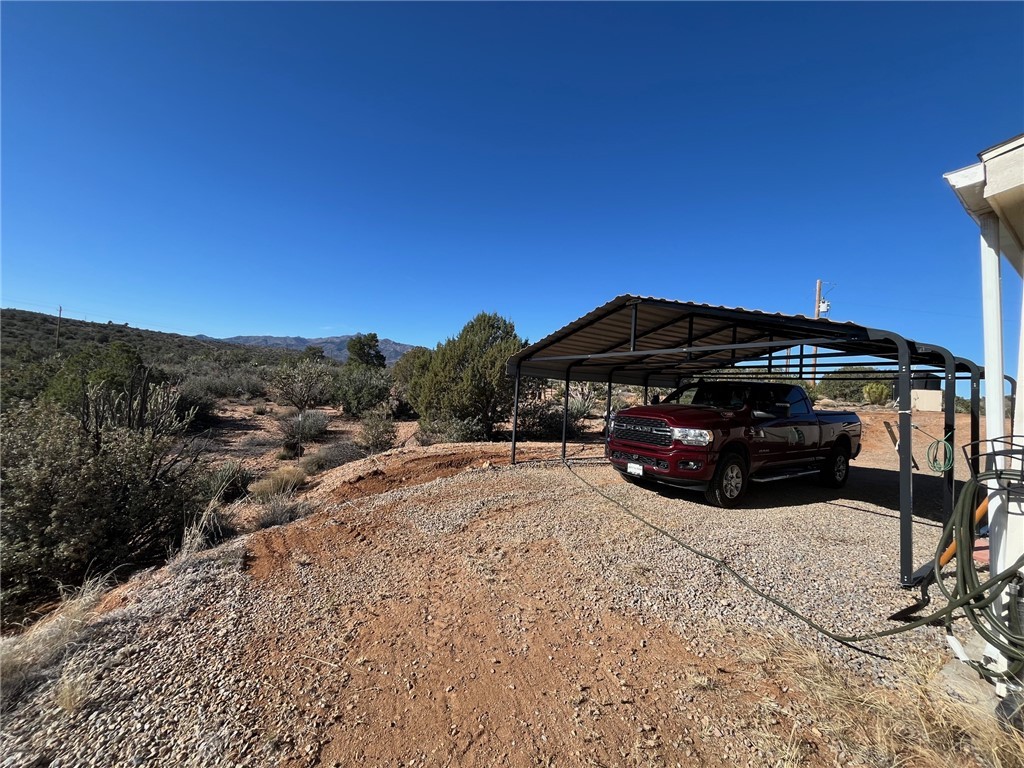 9918 East Blake Ranch Road Kingman, AZ 86401 - Photo 24 of 26 View of parking with a detached carport
