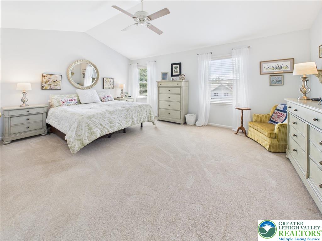 3006 Hope Ridge Drive Easton, PA 18045 - Photo 12 of 21 a spacious bedroom with a bed a table and painting on the wall
