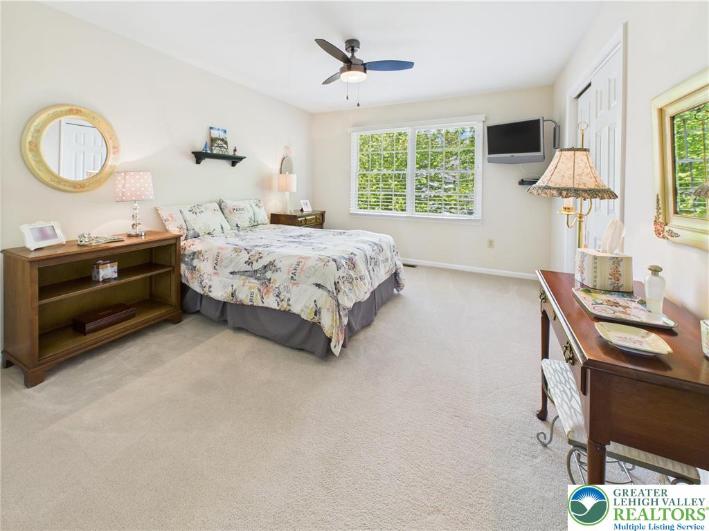 3006 Hope Ridge Drive Easton, PA 18045 - Photo 17 of 21 a bedroom with a bed and a chandelier