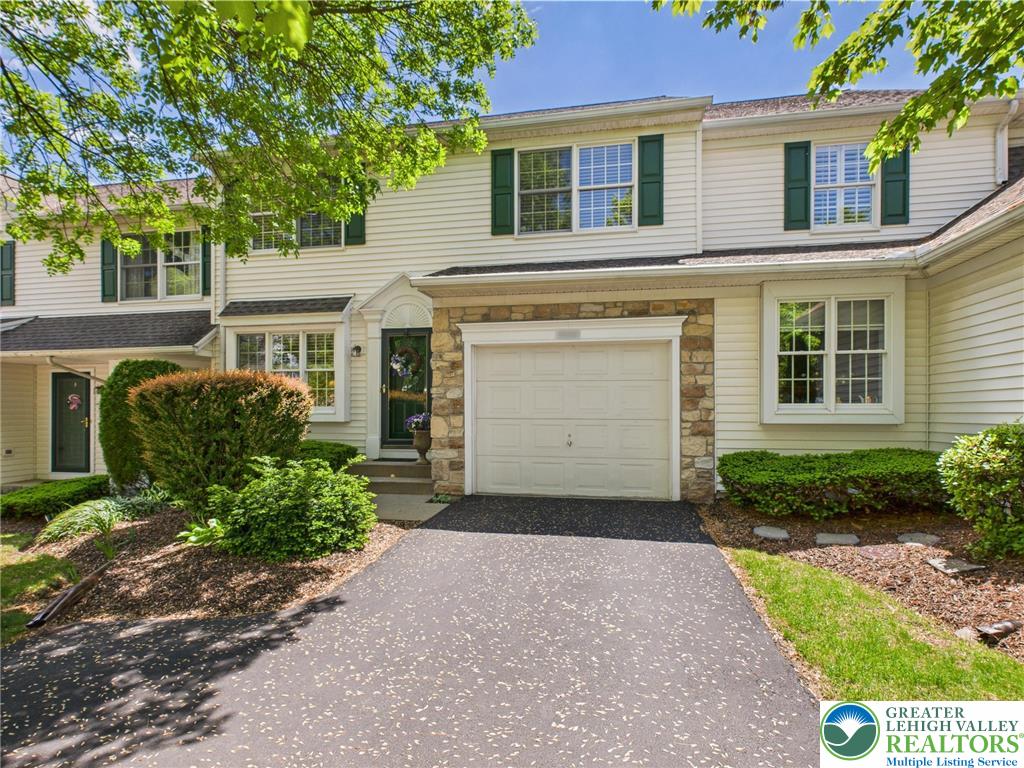 3006 Hope Ridge Drive Easton, PA 18045 - Photo 2 of 21 a front view of a house with a yard and garage
