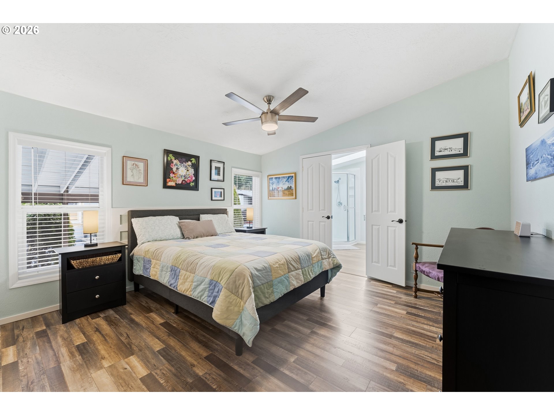 15768 Southeast Powell Boulevard, Unit 40 Portland, OR 97236 - Photo 12 of 33 a spacious bedroom with a bed and a desk