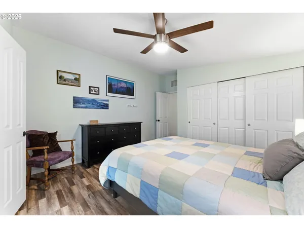 a bedroom with a bed and a chair