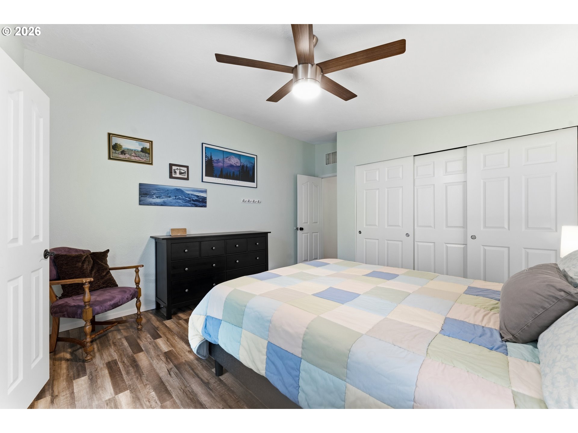 15768 Southeast Powell Boulevard, Unit 40 Portland, OR 97236 - Photo 13 of 33 a bedroom with a bed and a chair
