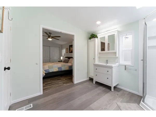 a bathroom with a double vanity sink and mirror