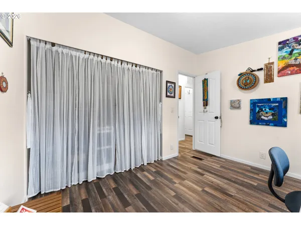a view of wooden floor in a livingroom