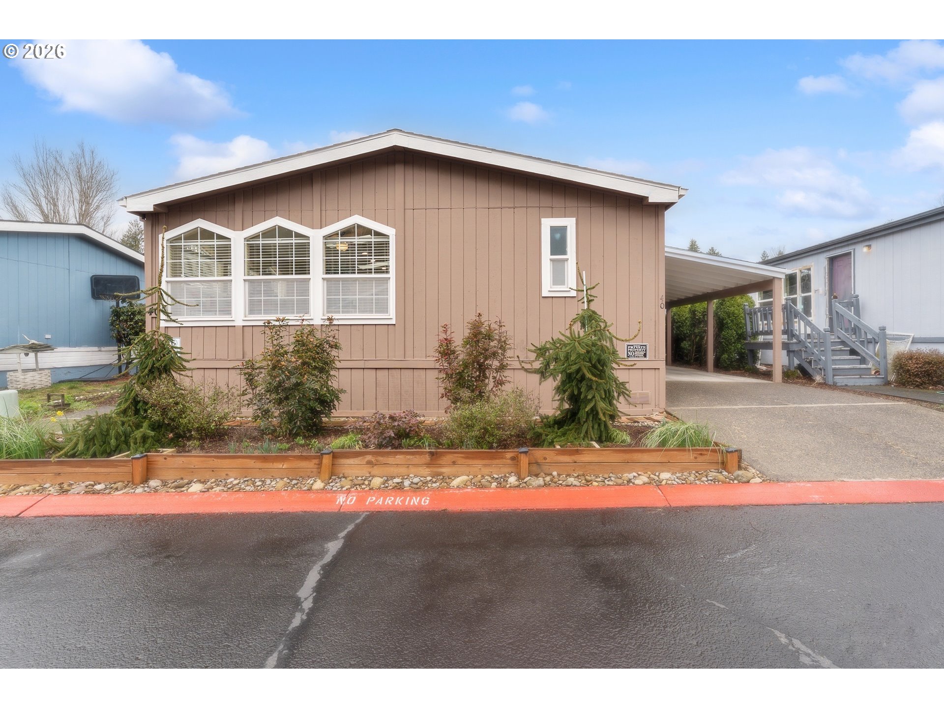 15768 Southeast Powell Boulevard, Unit 40 Portland, OR 97236 - Photo 27 of 33 a view of a house with a yard