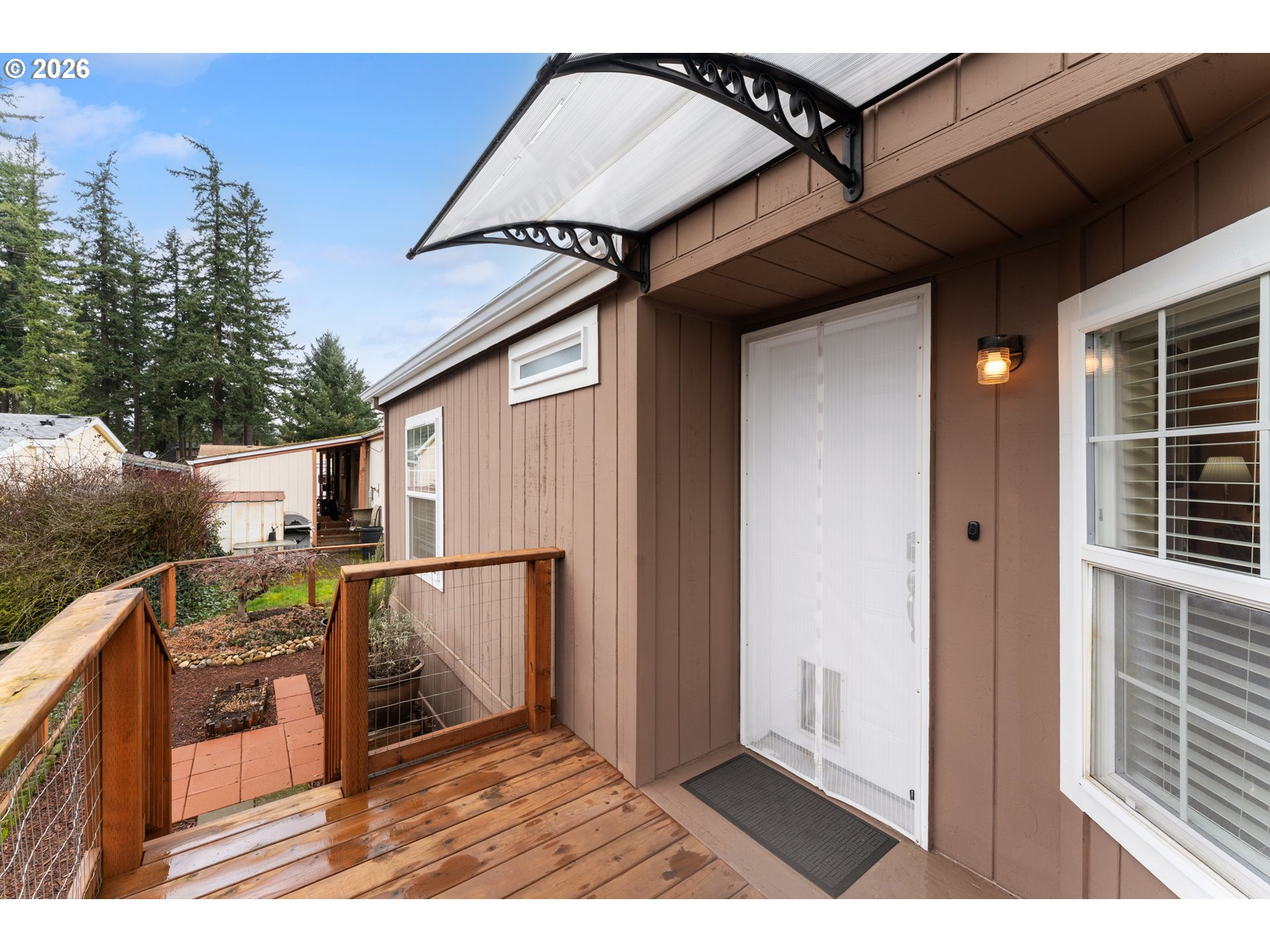 15768 Southeast Powell Boulevard, Unit 40 Portland, OR 97236 - Photo 28 of 33 a view of outdoor space kitchen and patio