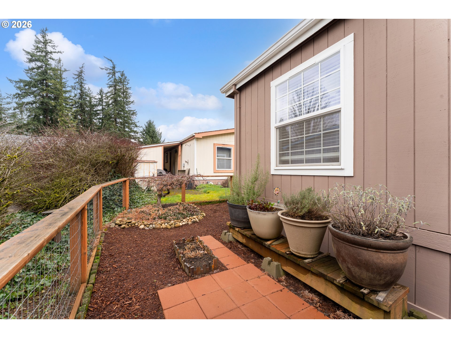 15768 Southeast Powell Boulevard, Unit 40 Portland, OR 97236 - Photo 29 of 33 a view of a chair and tables on the roof deck