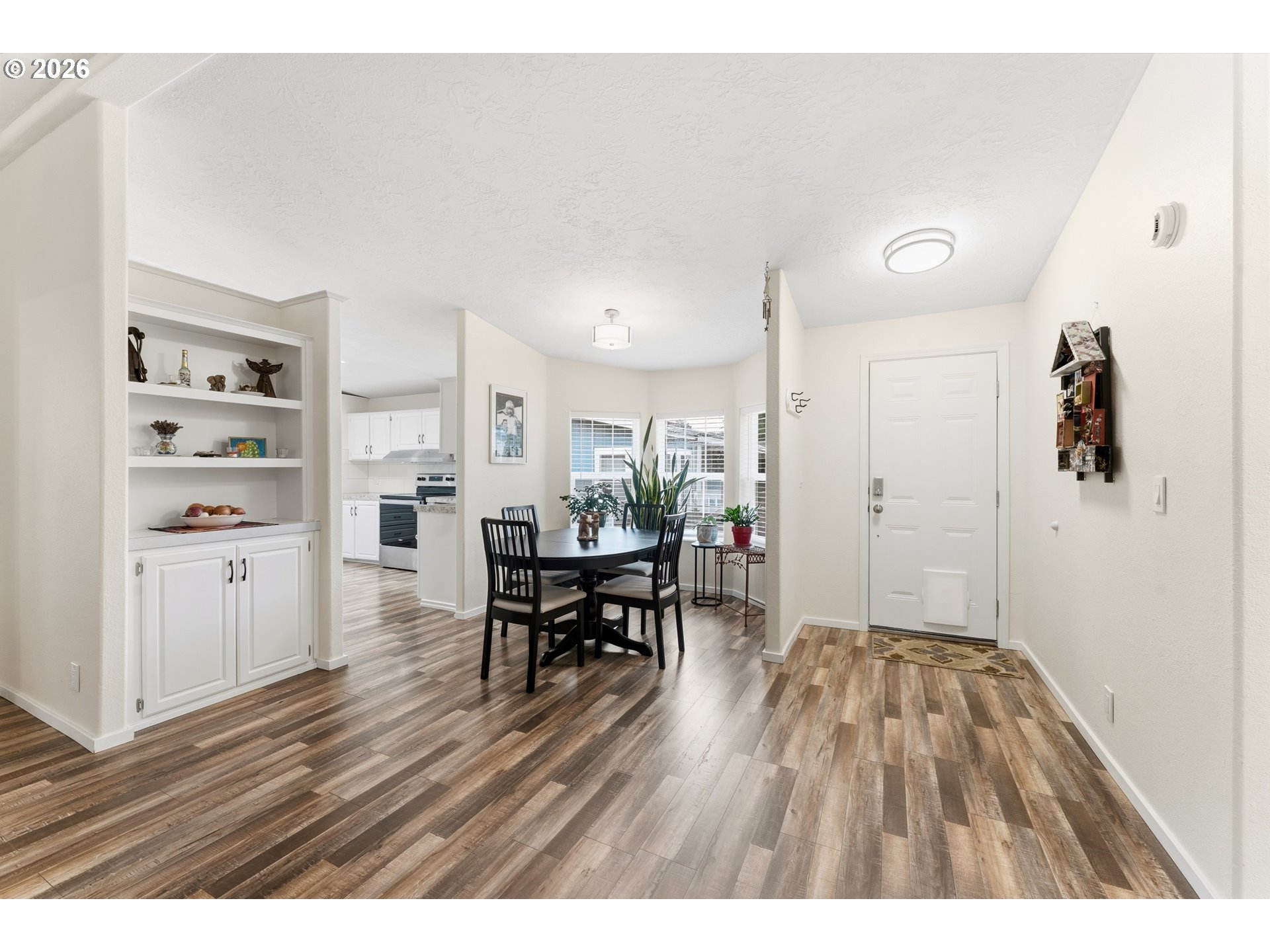 15768 Southeast Powell Boulevard, Unit 40 Portland, OR 97236 - Photo 3 of 33 a living room with furniture and wooden floor