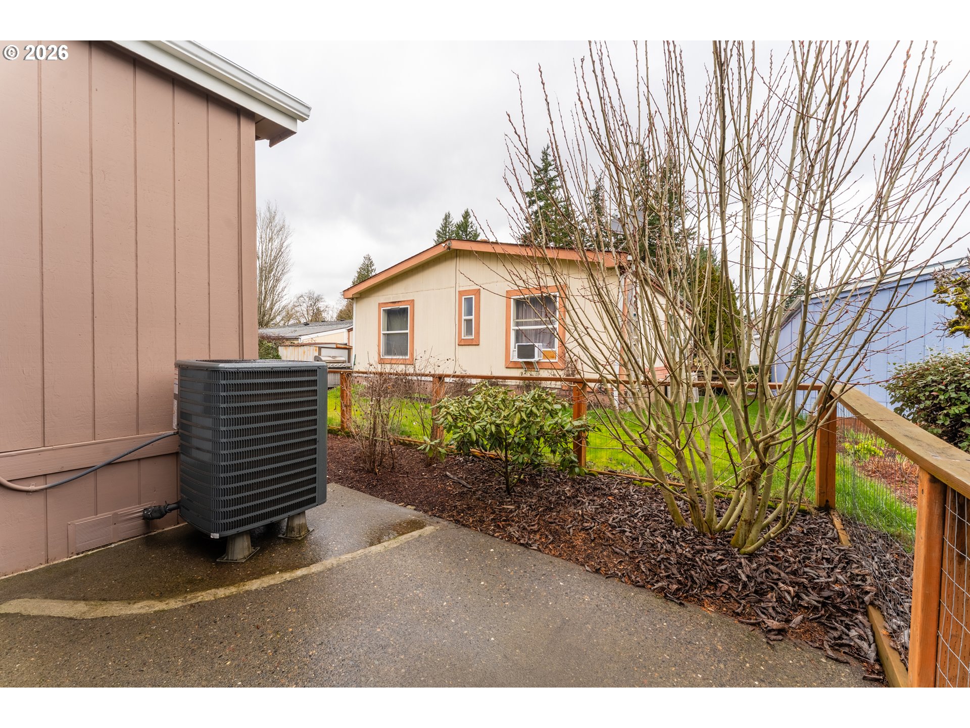 15768 Southeast Powell Boulevard, Unit 40 Portland, OR 97236 - Photo 31 of 33 a view of a back yard of the house