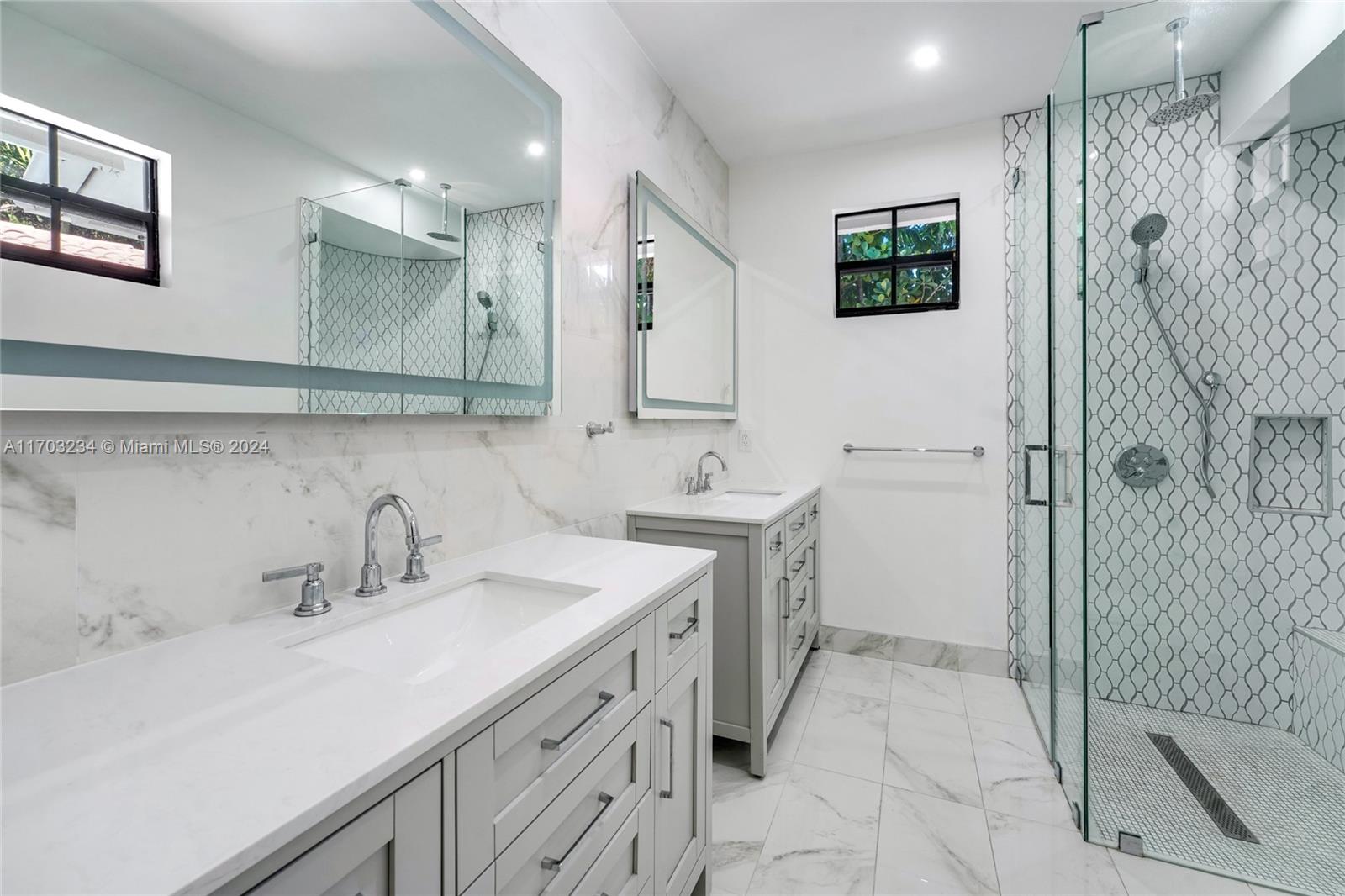 5660 Pine Tree Drive Miami Beach, FL 33140 - Photo 14 of 24 a bathroom with a sink toilet and shower