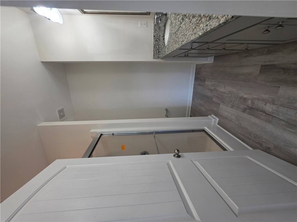 312 Phillips Drive Pendleton, SC 29670 - Photo 22 of 45 This bathroom features a contemporary vanity with a granite countertop and stylish plank flooring.