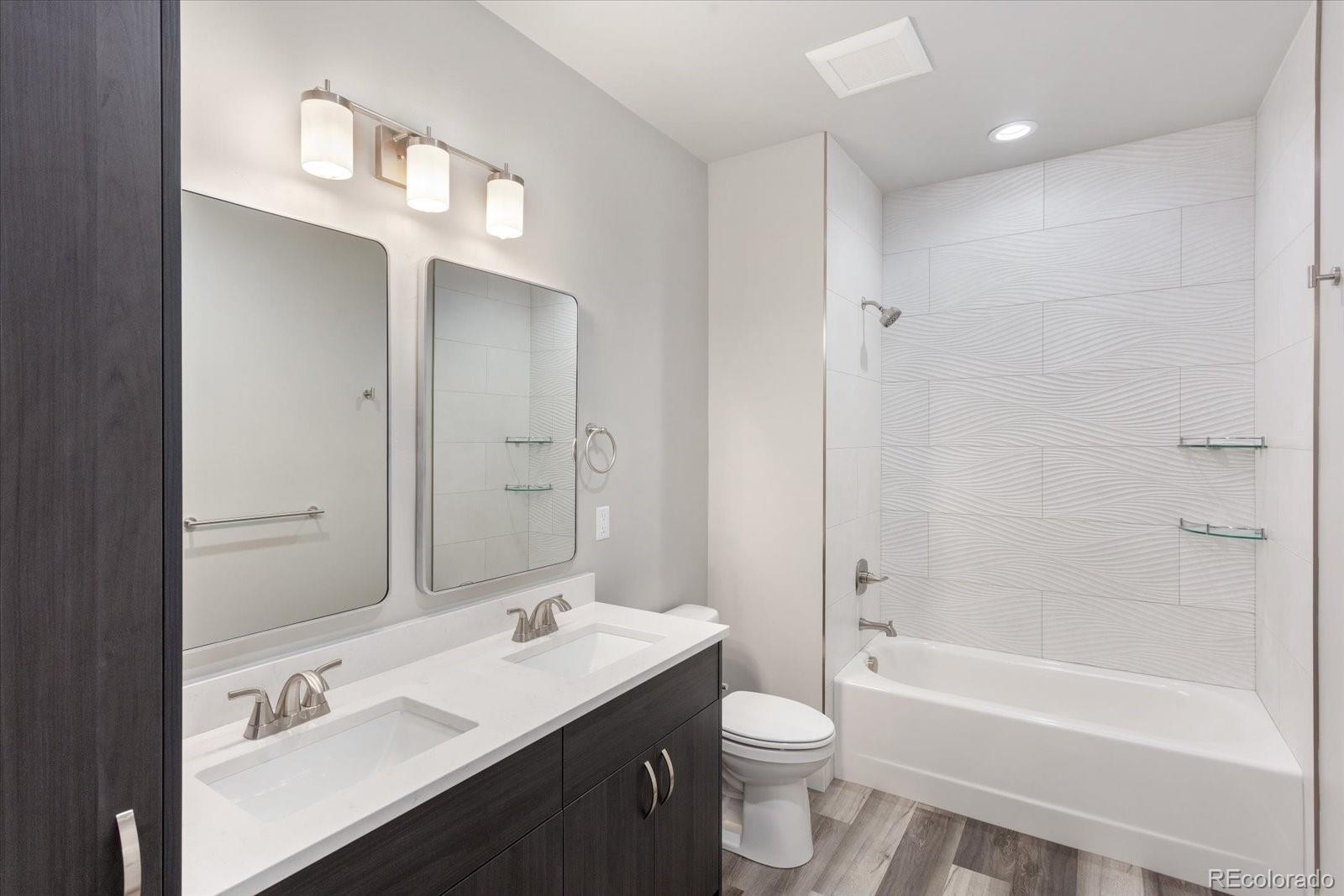 126 Southside Loop Salida, CO 81201 - Photo 17 of 29 a bathroom with a sink a toilet and a bathtub