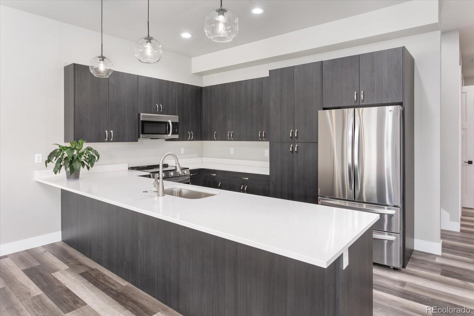126 Southside Loop Salida, CO 81201 - Photo 3 of 29 a kitchen with kitchen island a sink stainless steel appliances and counter space