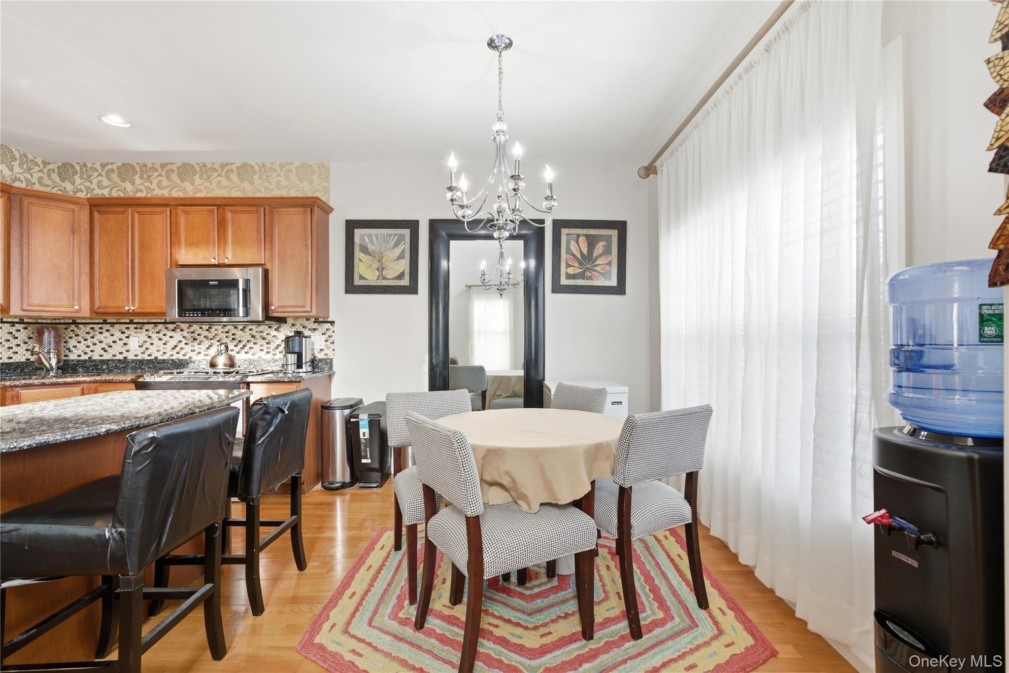 307 Medea Way Central Islip, NY 11722 - Photo 13 of 33 a view of a dining room with furniture window and wooden floor