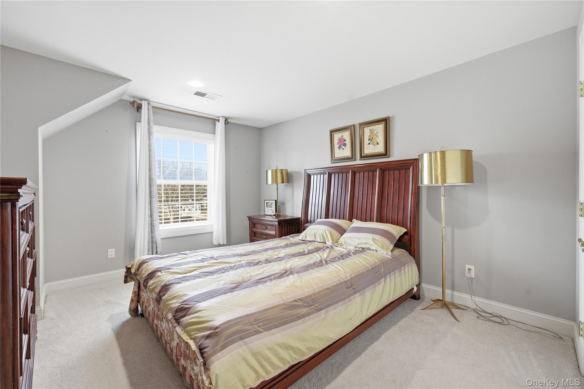 307 Medea Way Central Islip, NY 11722 - Photo 21 of 33 a bedroom with a bed and a window
