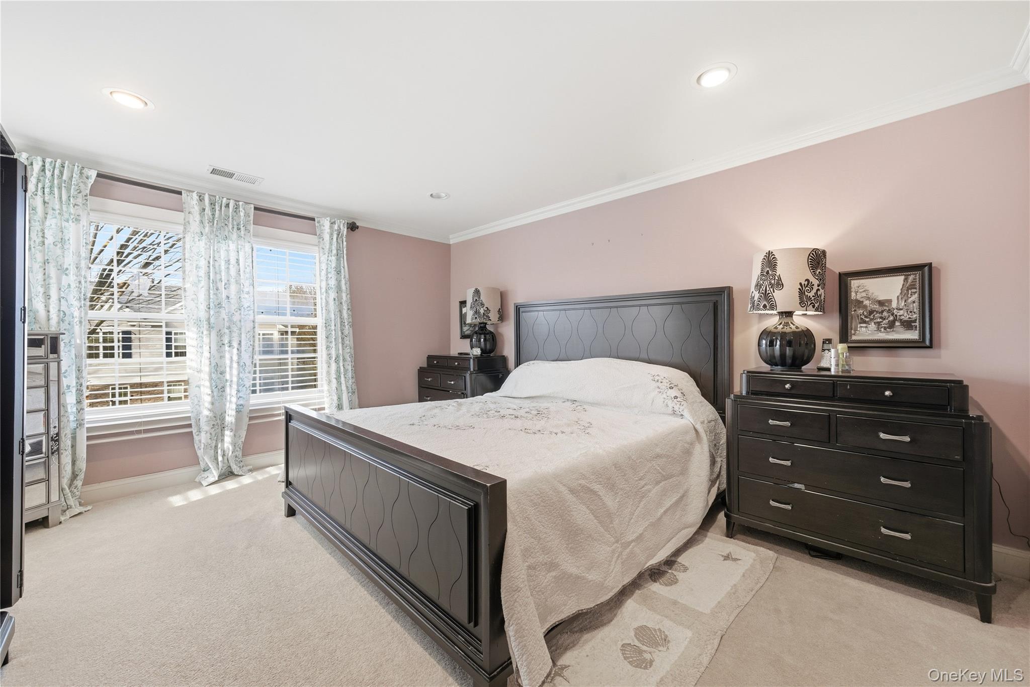 307 Medea Way Central Islip, NY 11722 - Photo 22 of 33 a spacious bedroom with a bed and a large window