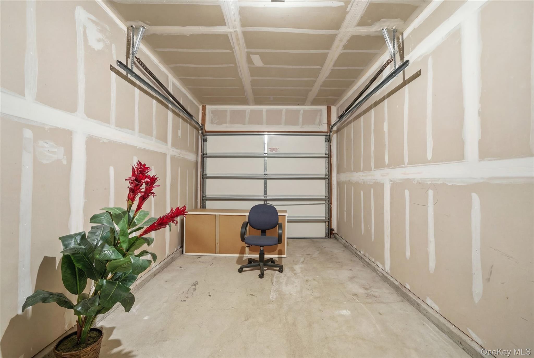 307 Medea Way Central Islip, NY 11722 - Photo 27 of 33 a workspace with furniture and potted plants