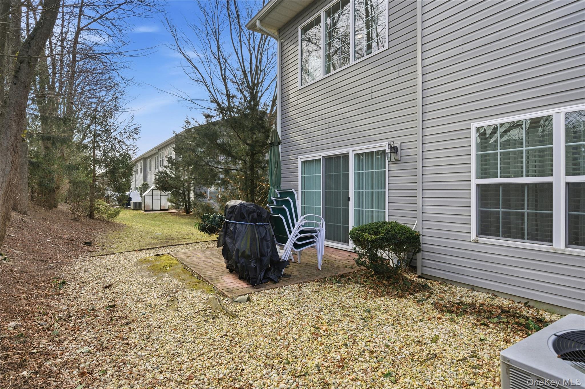 307 Medea Way Central Islip, NY 11722 - Photo 28 of 33 a view of a chair and table in backyard of the house