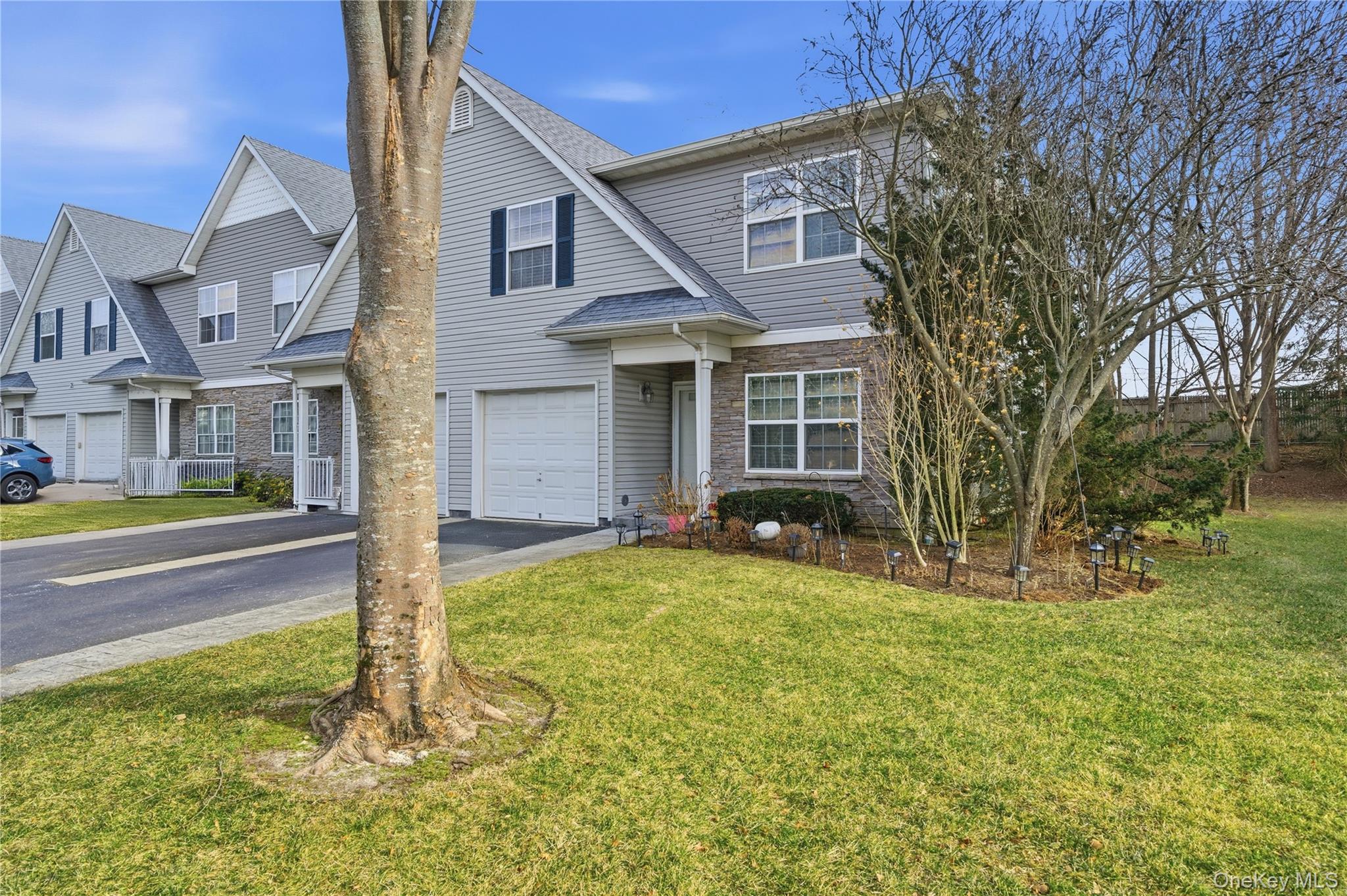 307 Medea Way Central Islip, NY 11722 - Photo 3 of 33 a view of a house with a big yard and large tree