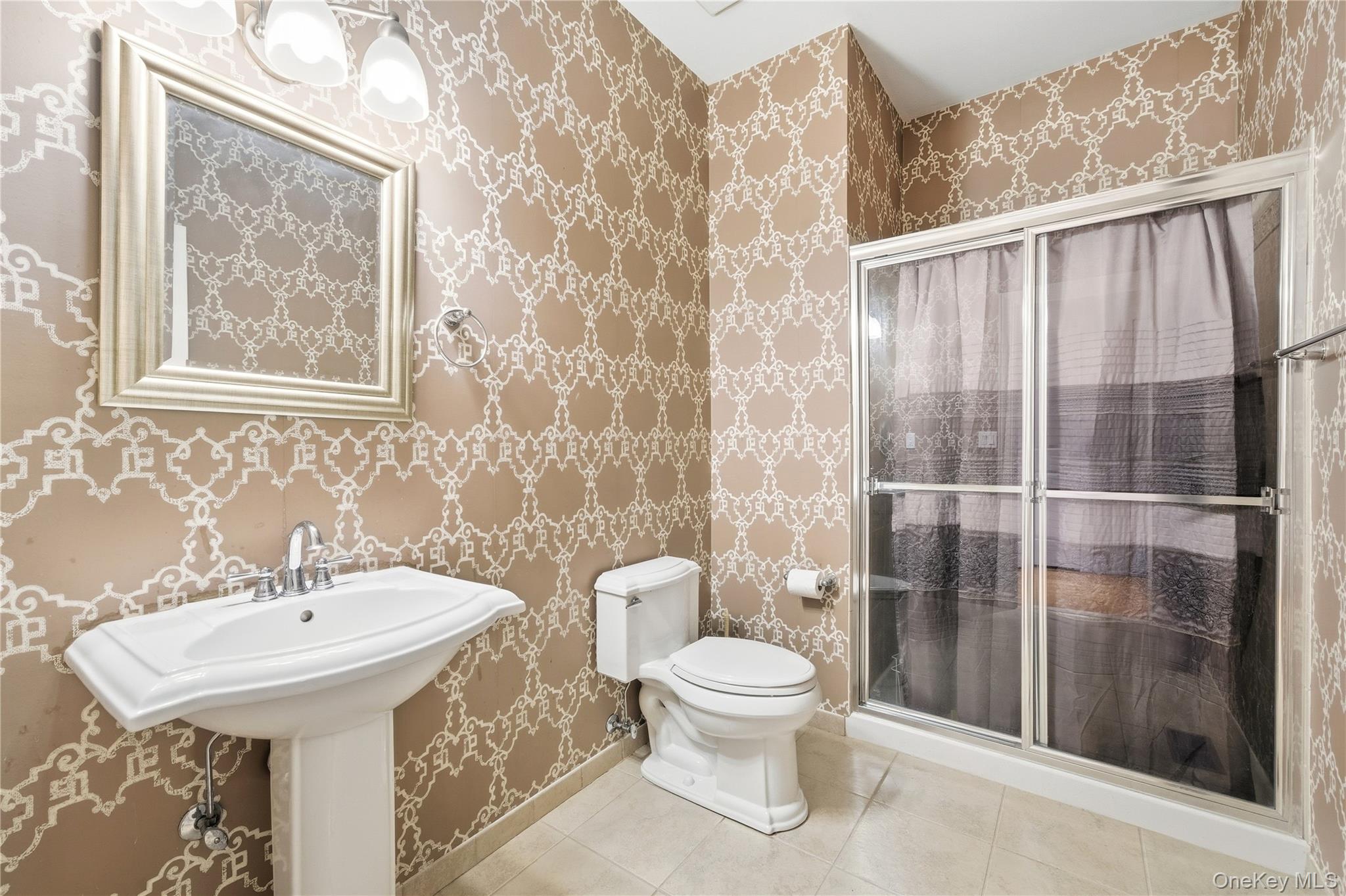 307 Medea Way Central Islip, NY 11722 - Photo 6 of 33 a bathroom with a toilet sink and shower