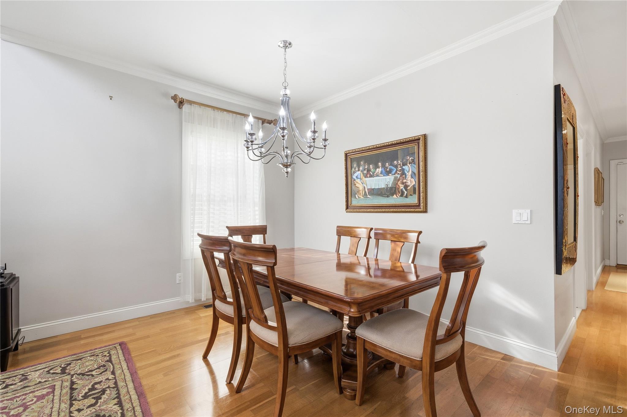 307 Medea Way Central Islip, NY 11722 - Photo 7 of 33 a view of a dining room with furniture and chandelier