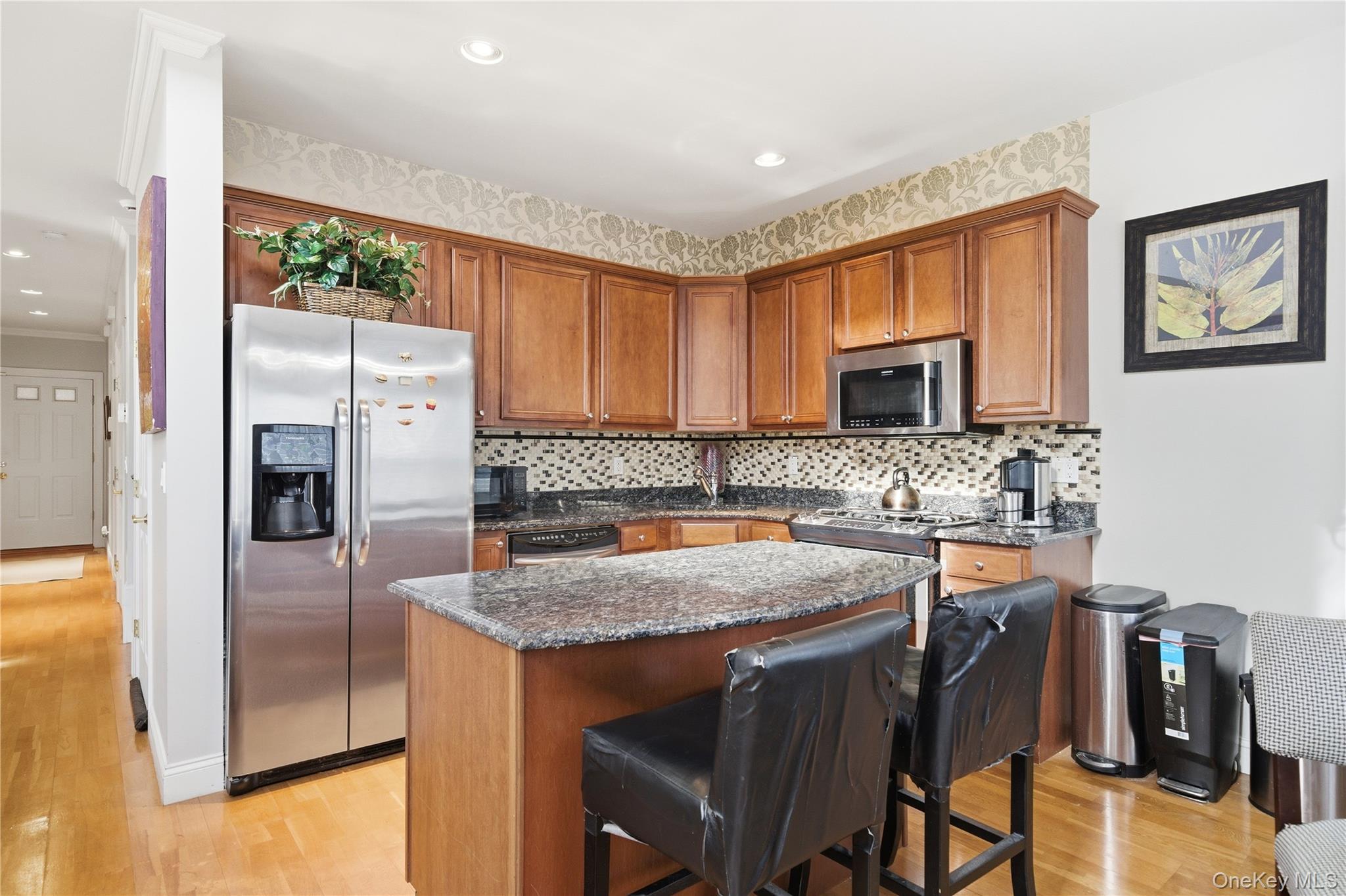 307 Medea Way Central Islip, NY 11722 - Photo 10 of 33 a kitchen with stainless steel appliances granite countertop a refrigerator and a stove top oven