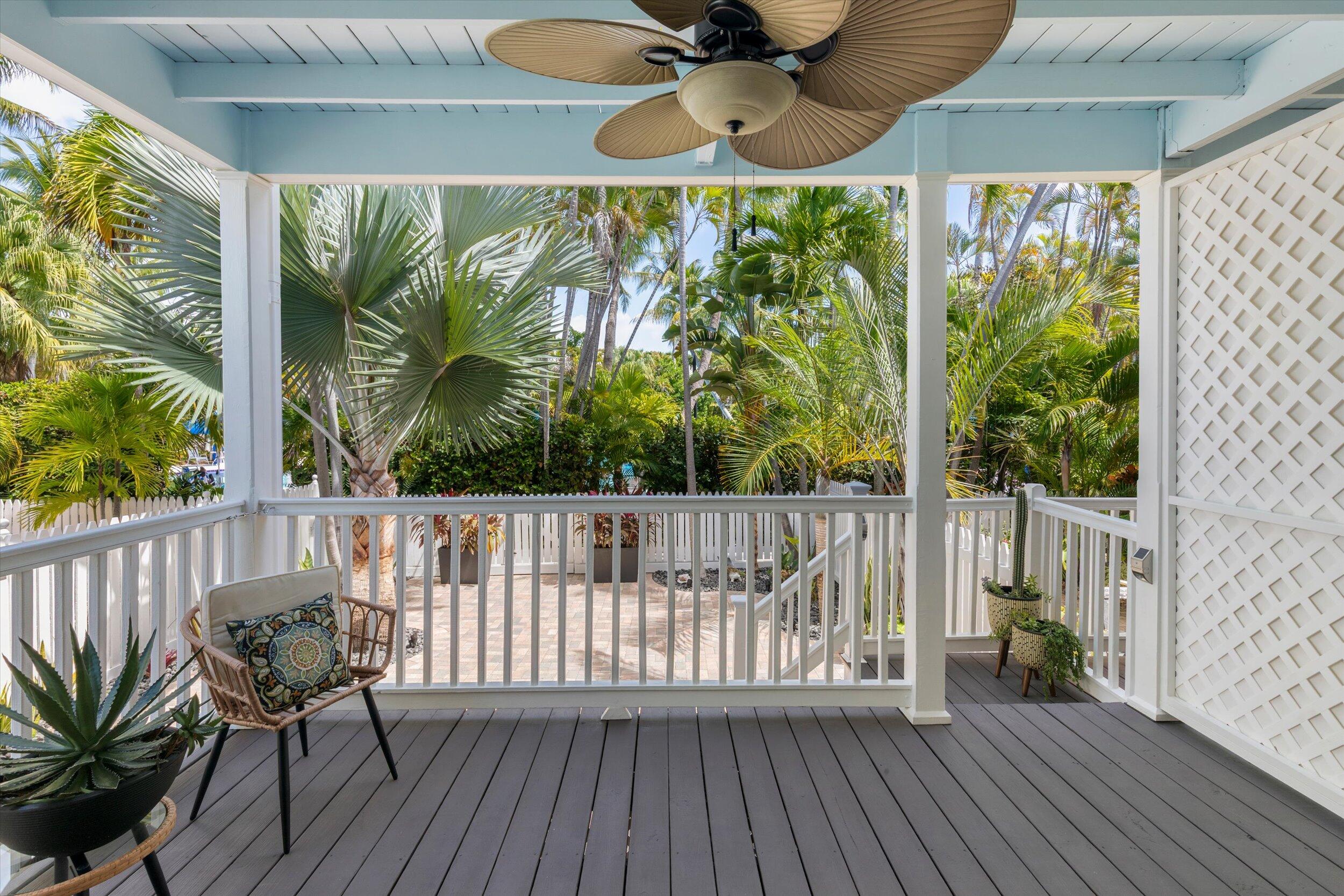 37 Spoonbill Way Key West, FL 33040 - Photo 20 of 88 a view of a balcony with furniture and wooden floor