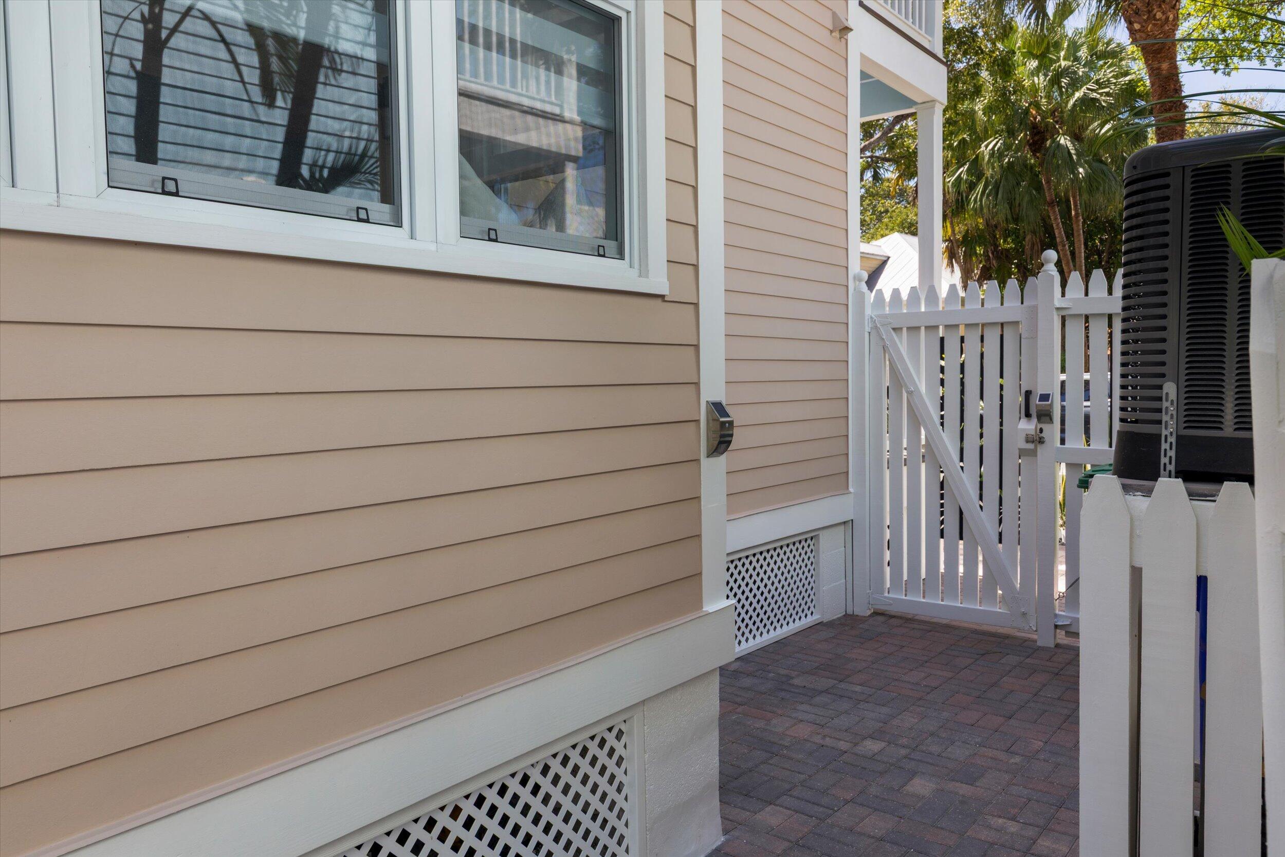 37 Spoonbill Way Key West, FL 33040 - Photo 28 of 88 a view of a house with a window and wooden fence