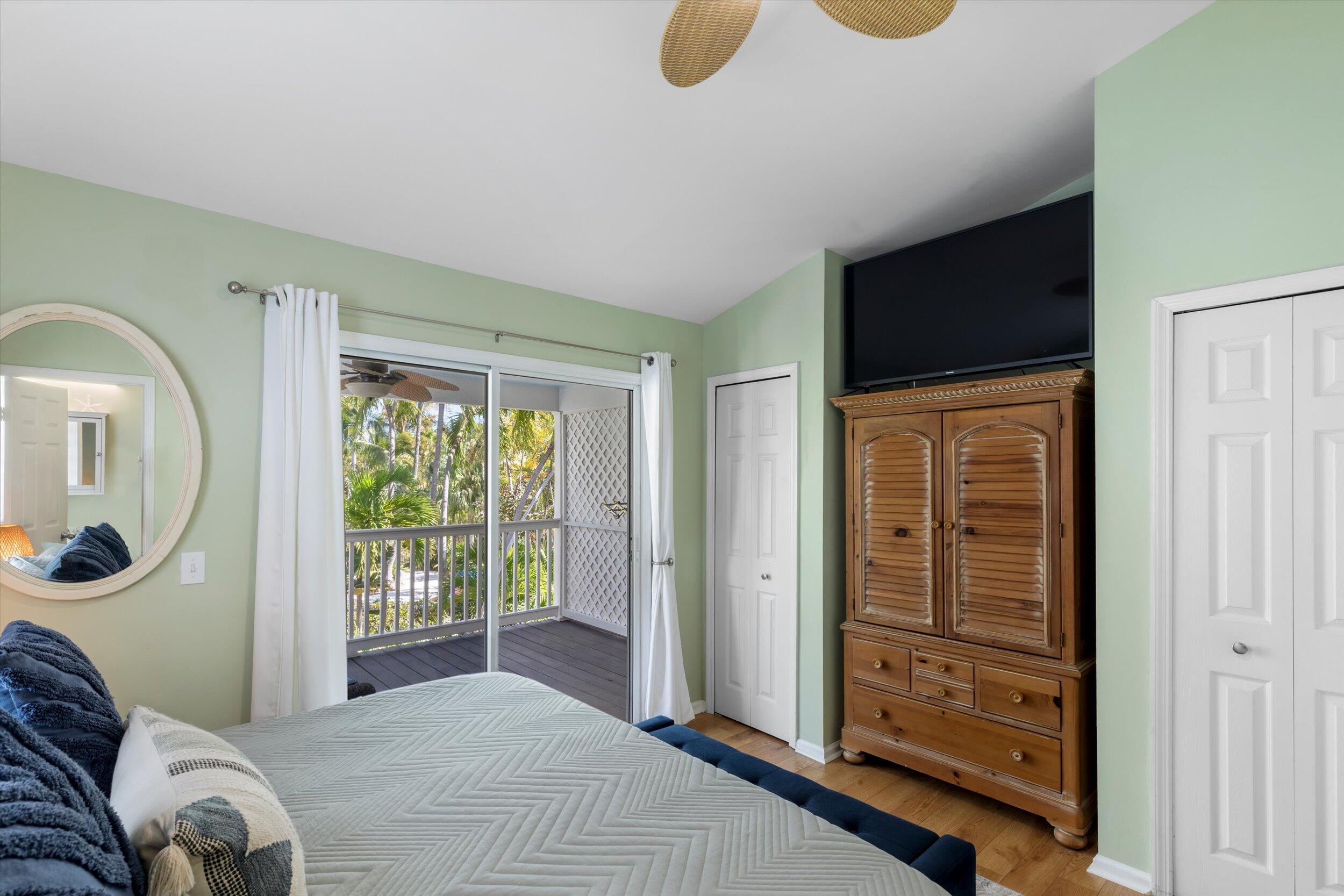 37 Spoonbill Way Key West, FL 33040 - Photo 42 of 88 a bedroom with furniture and a window