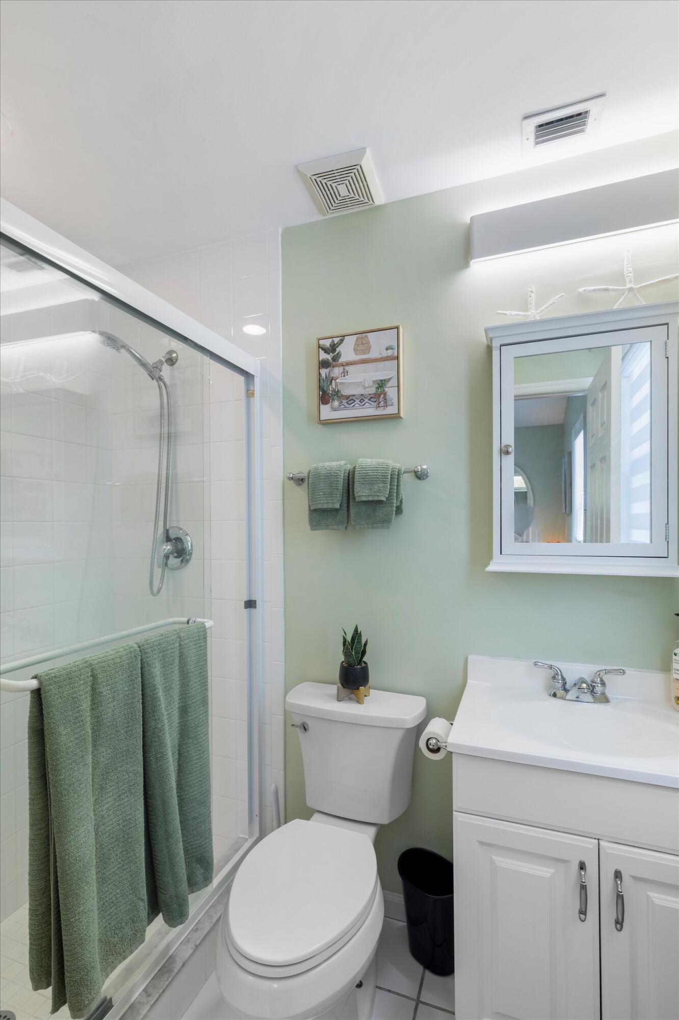 37 Spoonbill Way Key West, FL 33040 - Photo 49 of 88 a bathroom with a sink a toilet and a mirror