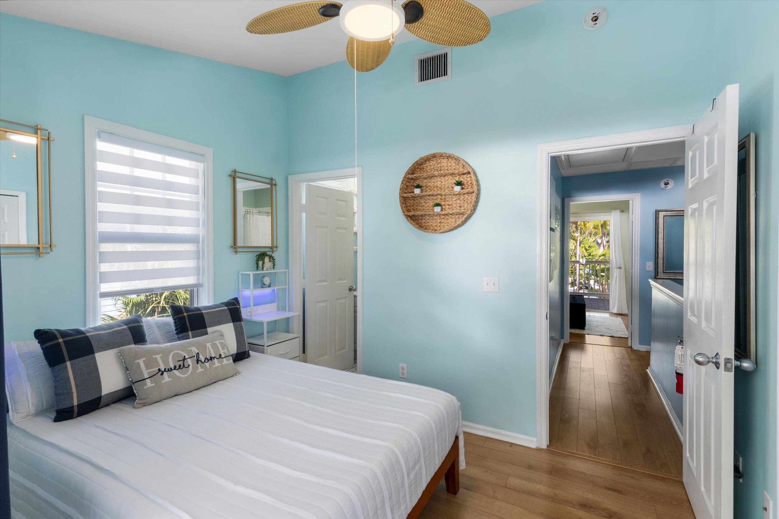 37 Spoonbill Way Key West, FL 33040 - Photo 54 of 88 a bedroom with a large bed and a chandelier