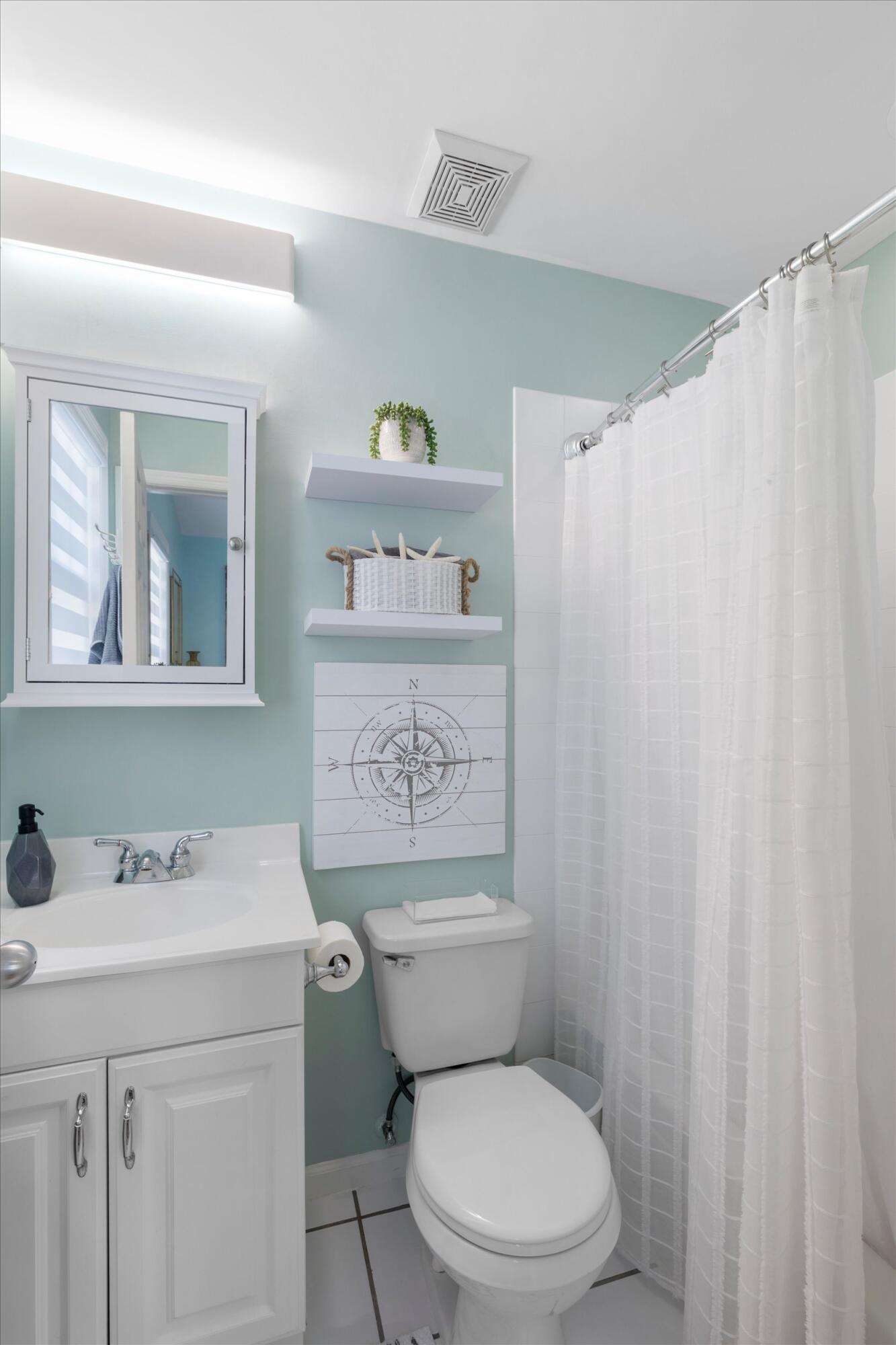 37 Spoonbill Way Key West, FL 33040 - Photo 56 of 88 a white toilet sitting next to a bathroom sink