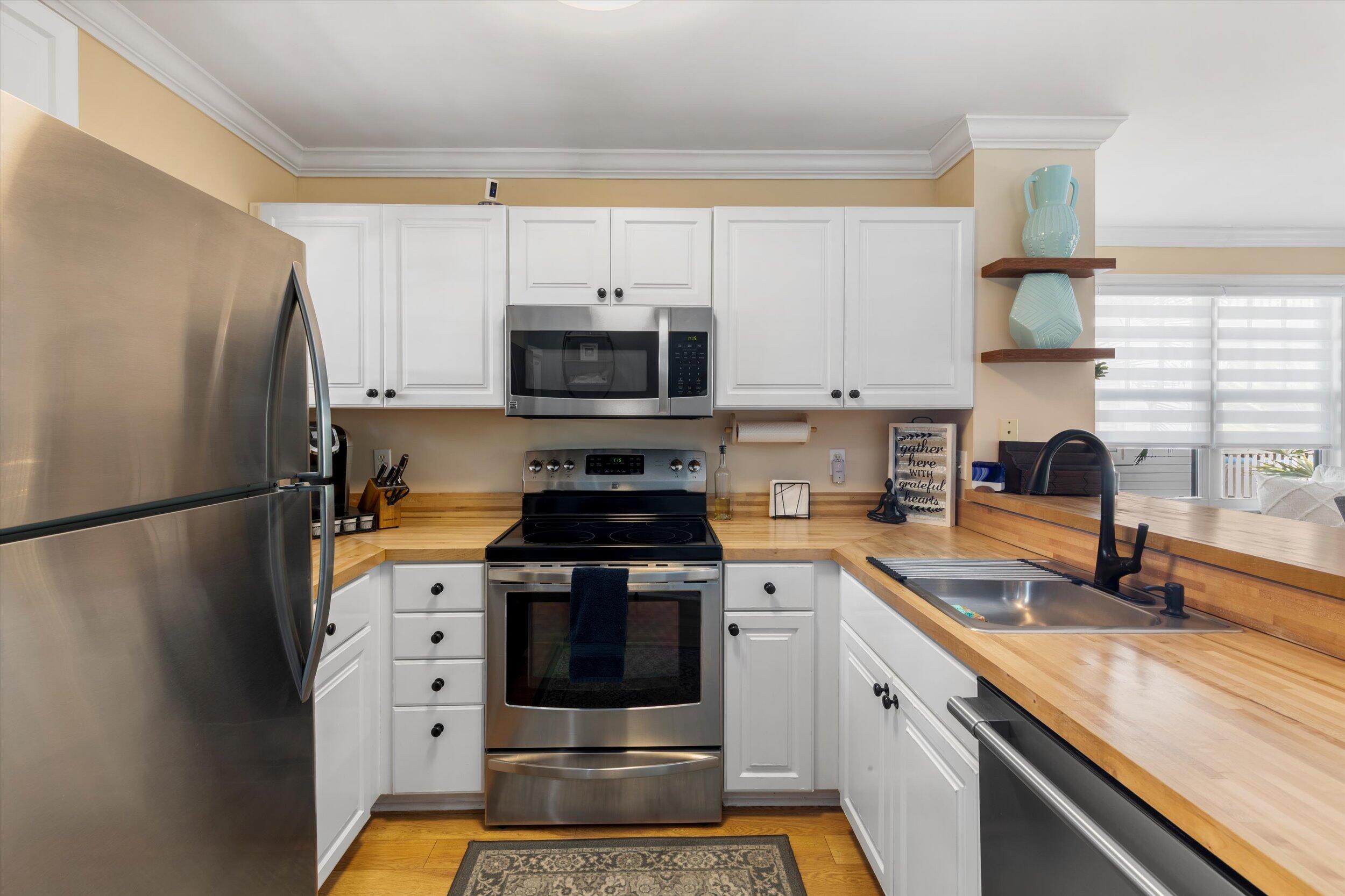 37 Spoonbill Way Key West, FL 33040 - Photo 7 of 88 a kitchen with stainless steel appliances a stove a sink and a refrigerator