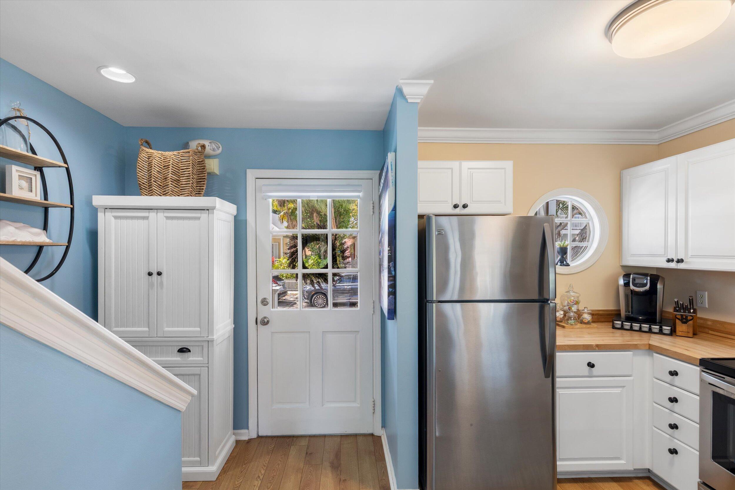 37 Spoonbill Way Key West, FL 33040 - Photo 9 of 88 a white refrigerator freezer and a stove sitting inside of a kitchen