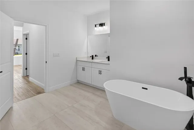 a bathroom with a bathtub and toilet