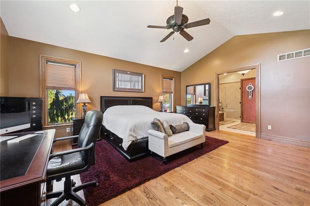 577 Bovard Luxor Road Luxor, PA 15662 - Photo 16 of 42 a bedroom with a bed a couch and potted plant with the dresser