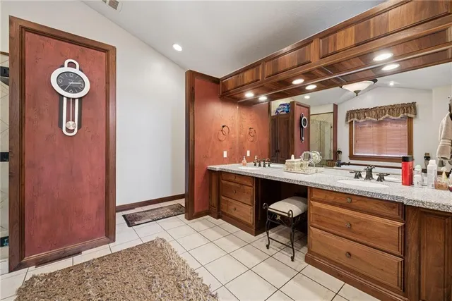 a bathroom with a sink a mirror and a shower