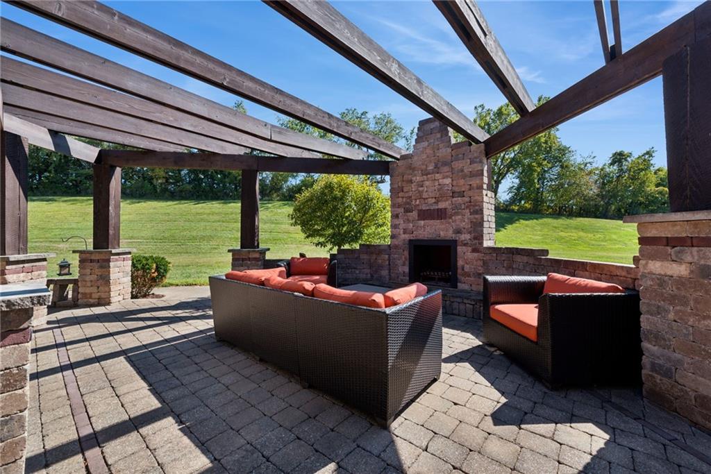 577 Bovard Luxor Road Luxor, PA 15662 - Photo 31 of 42 a living room with patio furniture and a floor to ceiling window