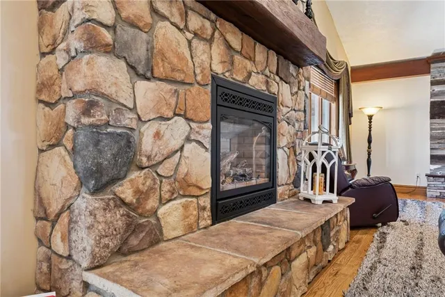 a living room with a couch and a fireplace