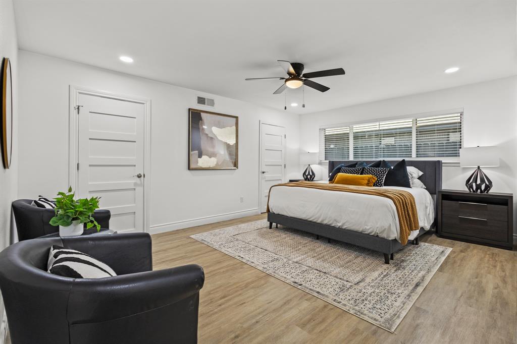 4105 Candlenut Lane Dallas, TX 75244 - Photo 13 of 27 a bedroom with a bed and ceiling fan