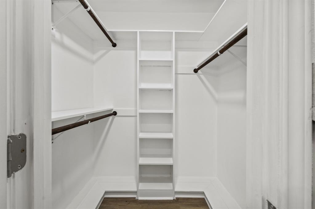 4105 Candlenut Lane Dallas, TX 75244 - Photo 16 of 27 a view of walk in closet with empty racks