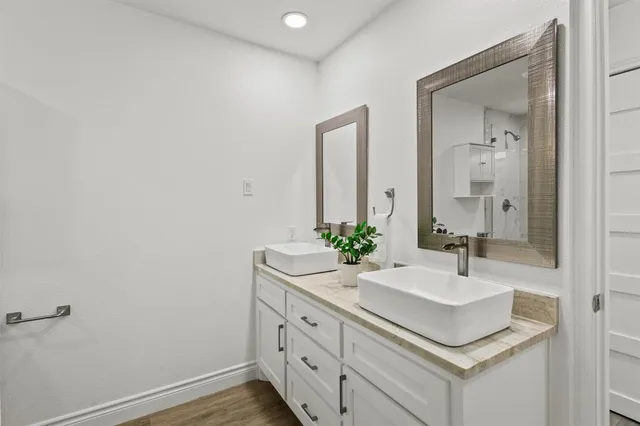 a bathroom with a sink and a mirror